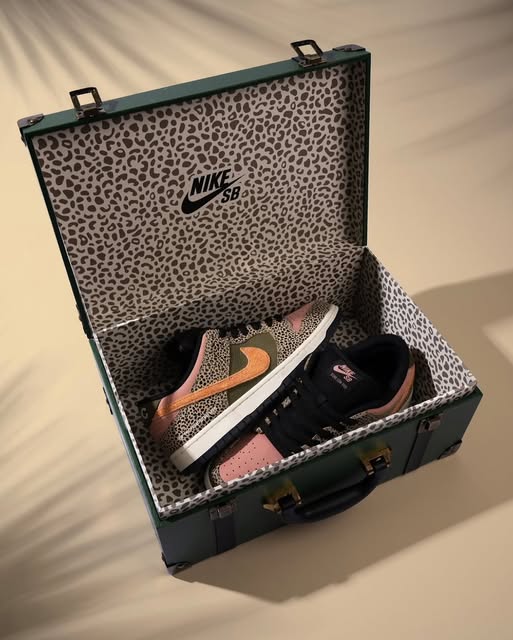 Nike SB Dunk Low Arts-Rec sneakers in a matching cheetah print suitcase-style box, showing pink and green panels