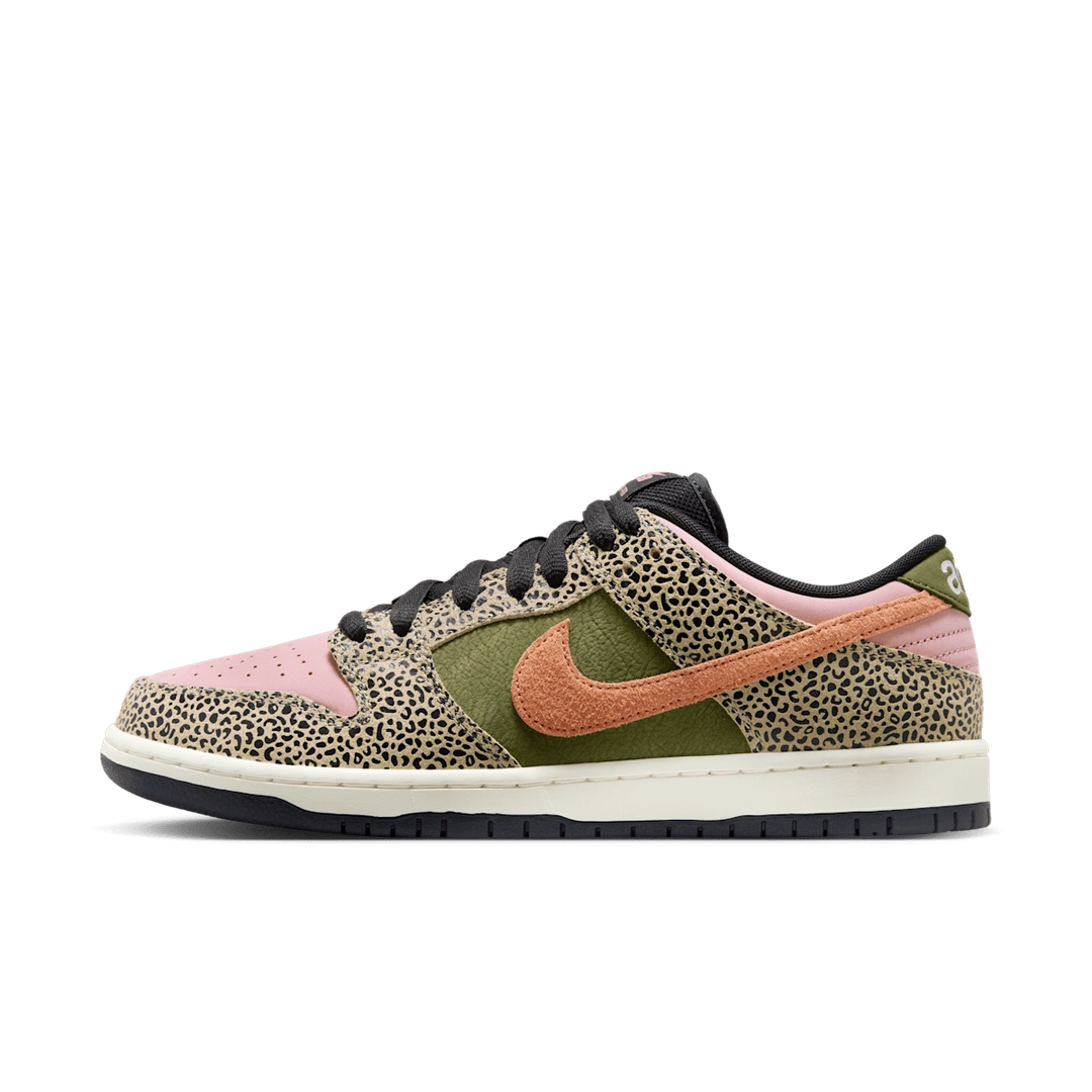 Nike SB Dunk Low Arts-Rec sneaker with pink, olive green, and cheetah print details, orange Swoosh, and black laces